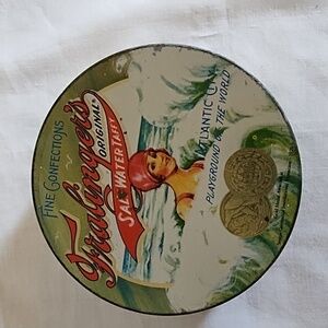 VINTAGE TIN - FRALINGER SALT WATER TAFFY TIN - GREAT PICTURES!